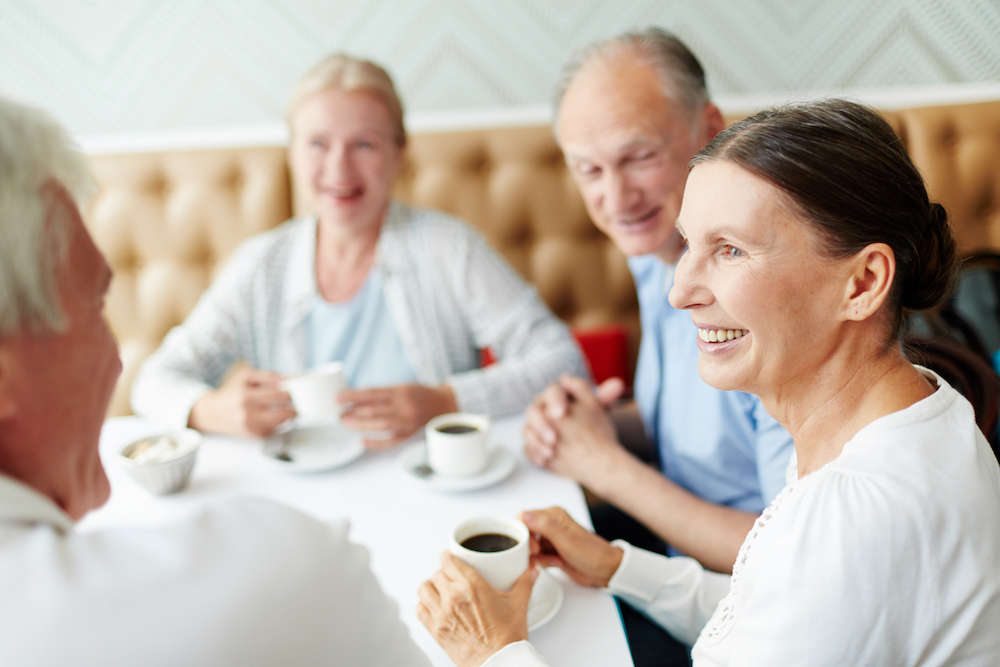 How to Convince a Family Member to Wear a Hearing Aid? four people eating brunch at a restaurant